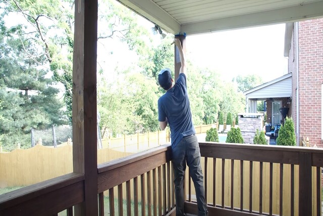 Glendale Painting worker deck painting an enclosed front porch